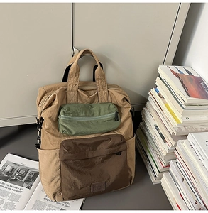 Detail view of khaki nylon backpack with green contrast pockets and textured woven straps