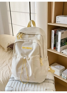 Detail of off-white nylon backpack with RKDBAG embroidery and drawstring pocket