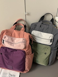 Dual-tone nylon backpacks with multiple pockets and waterproof fabric in a casual school style