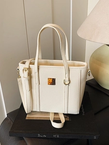 Chic cream lychee pattern leather bucket bag with gold hardware and shoulder strap