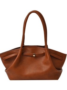 Minimalist brown leather tote bag with unique side pleats and vintage metal buckle detail