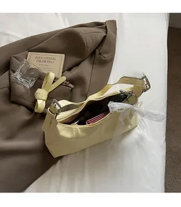 Internal view of the yellow leather tote showing spacious capacity for phone and wallet