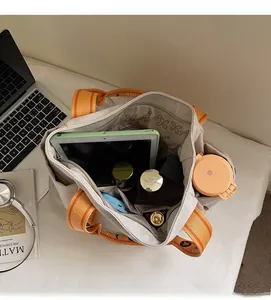 Spacious interior of off-white canvas tote bag showing large capacity and daily essentials