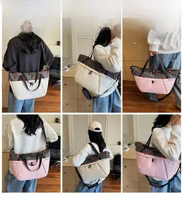 Detail view of large nylon tote bags in beige and pink with mesh trim and shoulder straps