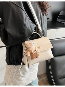 Chic beige crossbody square handbag with a cute plush bear pendant accessory