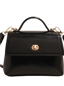 Classic black glossy faux leather crossbody bag with gold hardware and top handle strap