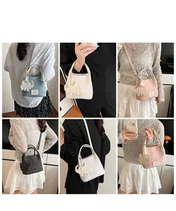 Litchi pattern bucket bag in various colors with cute elephant charm for women