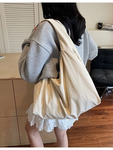 Minimalist cream white large capacity tote bag shown on model for daily commute style