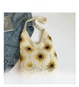 Close-up of handmade crochet tote bag with sunflower pattern and detailed knit texture
