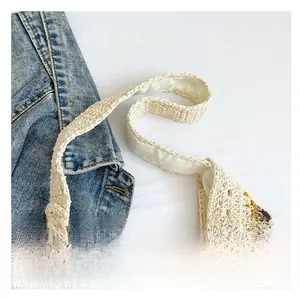 Detailed close-up showing handwoven beige cotton straps and floral sunflower crochet patterns