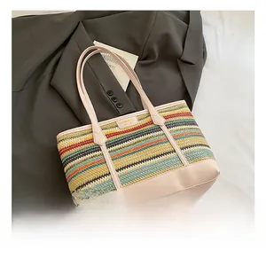 Detailed macro view of colorful straw woven tote texture with pink leather handles