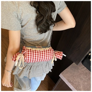 Crossbody bag in candy shape with red gingham pattern, lace trim and chain strap