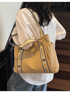 Large mustard yellow canvas tote bag with decorative printed wide shoulder strap
