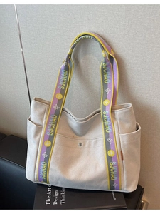 Large cream canvas tote bag with colorful SJCHAO strap and multi-pocket utility design