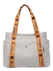 Large off-white canvas tote bag featuring orange printed wide straps and side pockets