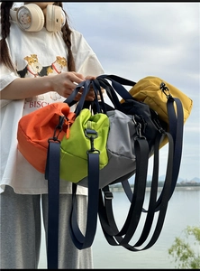 Detailed view of colorful nylon bowling bags with durable ripstop fabric and adjustable straps
