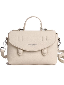 Minimalist beige crossbody bag in lychee texture leather with top handle and strap