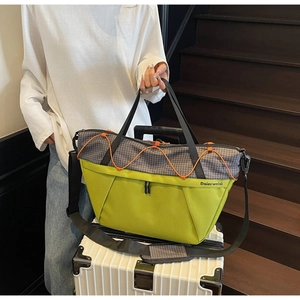 Detail of travel bag showing luggage sleeve feature for easy attachment to suitcase