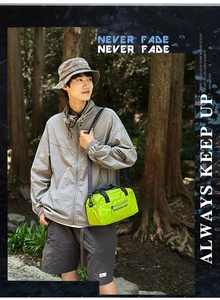Neon green nylon crossbody bag with SHILAIEN-ART logo shown in an outdoor hiking setting