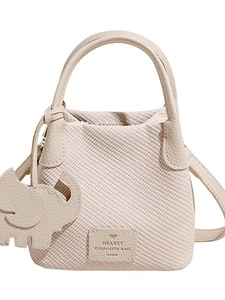 Beige woven texture bucket bag with lychee leather handles and cute elephant charm