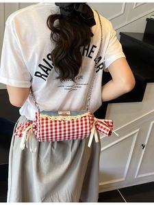 Candy-shaped crossbody bag with red and white plaid pattern and denim lace details