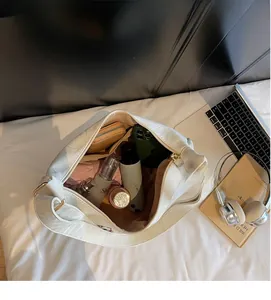 Top view of white ruched tote bag showing large capacity for phone and cosmetics