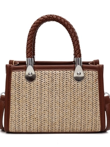Retro woven straw tote bag with brown leather trim and metallic buckle accents