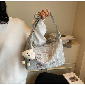 Quilted grey tote bag with MashaKeke cat embroidery and soft cloud plush pendant charm
