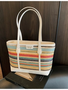 Colorful striped woven straw tote bag with white leather handles for beach and summer