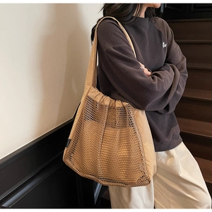 Detail of khaki nylon hollow mesh tote bag with double-layer design and large capacity