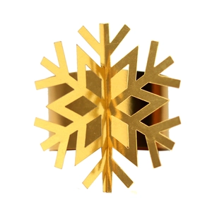 Macro view of gold snowflake napkin ring with 3D geometric mirror finish texture
