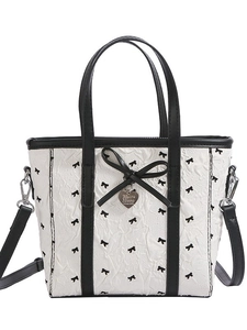 Sac seau en nylon blanc avec motif nœud noir et pendentif métallique en forme de cœur