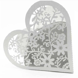Close-up of laser-cut heart candy box with intricate floral hollow-out patterns