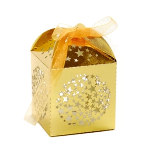 Golden laser-cut star gift box with festive ribbon bow and metallic finish