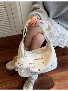 Cream white large capacity tote bag with cute embroidery and a plush cloud charm