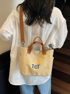 Grand sac cabas minimaliste en toile avec anses brunes et broderie TCT pour femme
