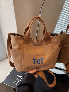 Sac fourre-tout en toile marron avec broderie TCT bleue et multiples poches d'usage