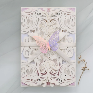Detailed laser-cut wedding invitation with lavender butterfly and ivory ribbon bow