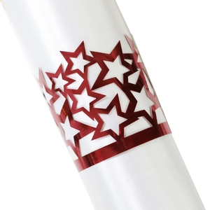 Close-up of metallic red star napkin ring with hollow stars on white fabric detail