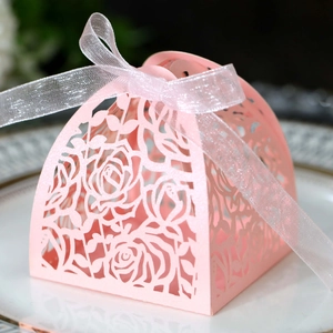 Pink laser-cut rose gift box with organza ribbon for wedding favors and candies