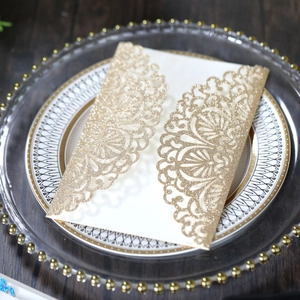 Detailed laser-cut hollow lace design of champagne gold glitter wedding invitation card