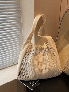 Hollow nylon tote bag in cream white with mesh design for summer vacation and travel