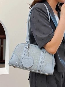 Light blue lychee leather shoulder bag with decorative metal ring and strap details