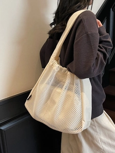Minimalist beige mesh tote bag for summer beach travel with inner pouch and drawstring
