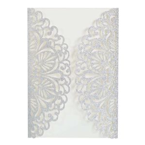 Detailed laser-cut mandala pattern on silver glitter wedding invitation card