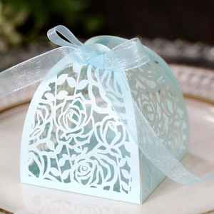 Light blue laser-cut wedding favor box with rose patterns and matching silk ribbon bow