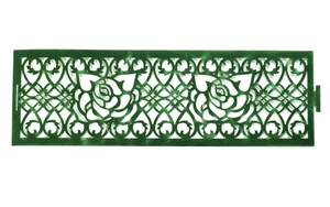 Detail view of dark green laser-cut floral napkin ring with intricate rose patterns