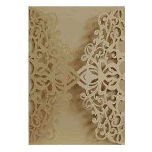 Laser cut laser hollow wedding invitation cover in metallic gold pearlescent paper