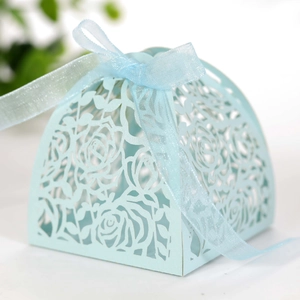Detailed laser-cut light blue rose gift box featuring a soft organza ribbon bow on top