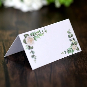 Elegant floral place card with pink roses on premium white textured paper for weddings